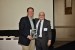 Dr. Nagib Callaos, General Chair, giving Dr. Robert Hammond a plaque "In Appreciation for Delivering a Great Keynote Address at a Plenary Session."